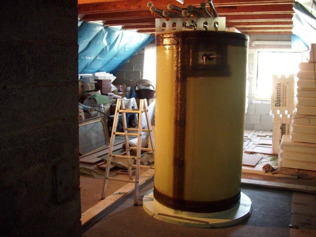 The hot water tank is built in an attic.