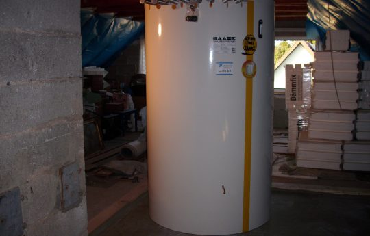 The installed hot water tank in the attic.